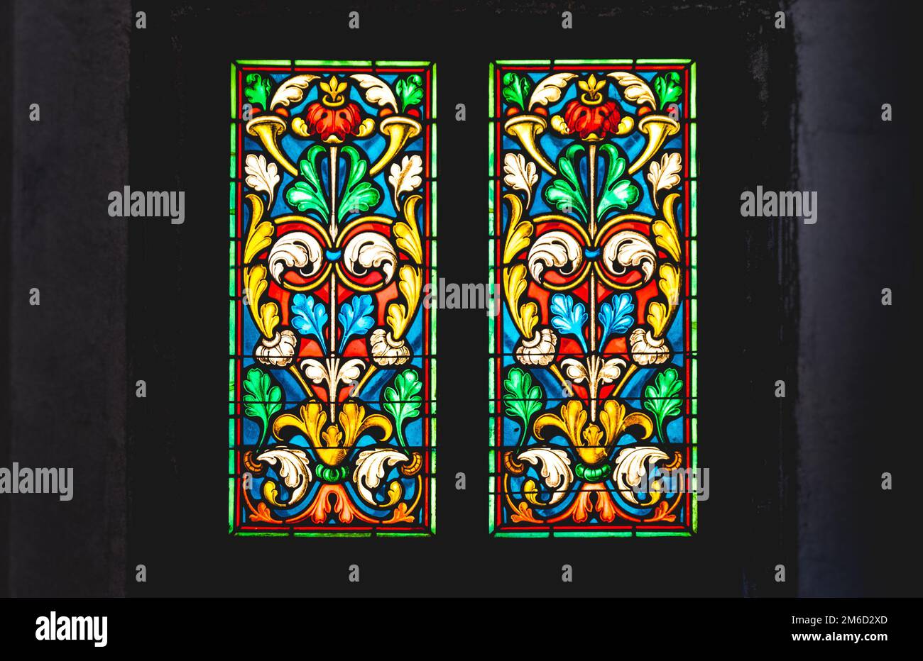 Coloured stained glass in dark background Stock Photo