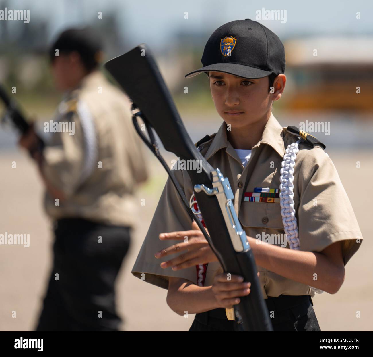 California Cadet Corps Cadet Sgt. Adam Habbal, a sixth grader in Tropico Middle School’s 277th Battalion, spins his rifle during an exhibition drill performance at the Corps’ statewide drill competition, April 23, 2022, at Joint Forces Training Base, Los Alamitos, California. California Cadet Corps is a school-based youth leadership development program run by the California Military Department’s Task Force Torch which focuses on youth and community programs. Stock Photo