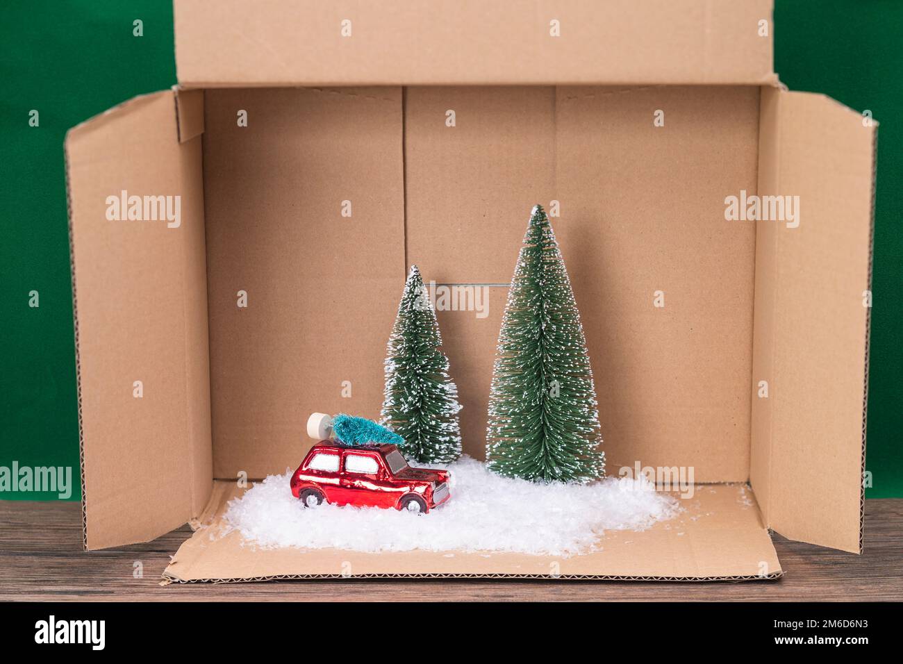 Scale car with trees and snow in a box Stock Photo