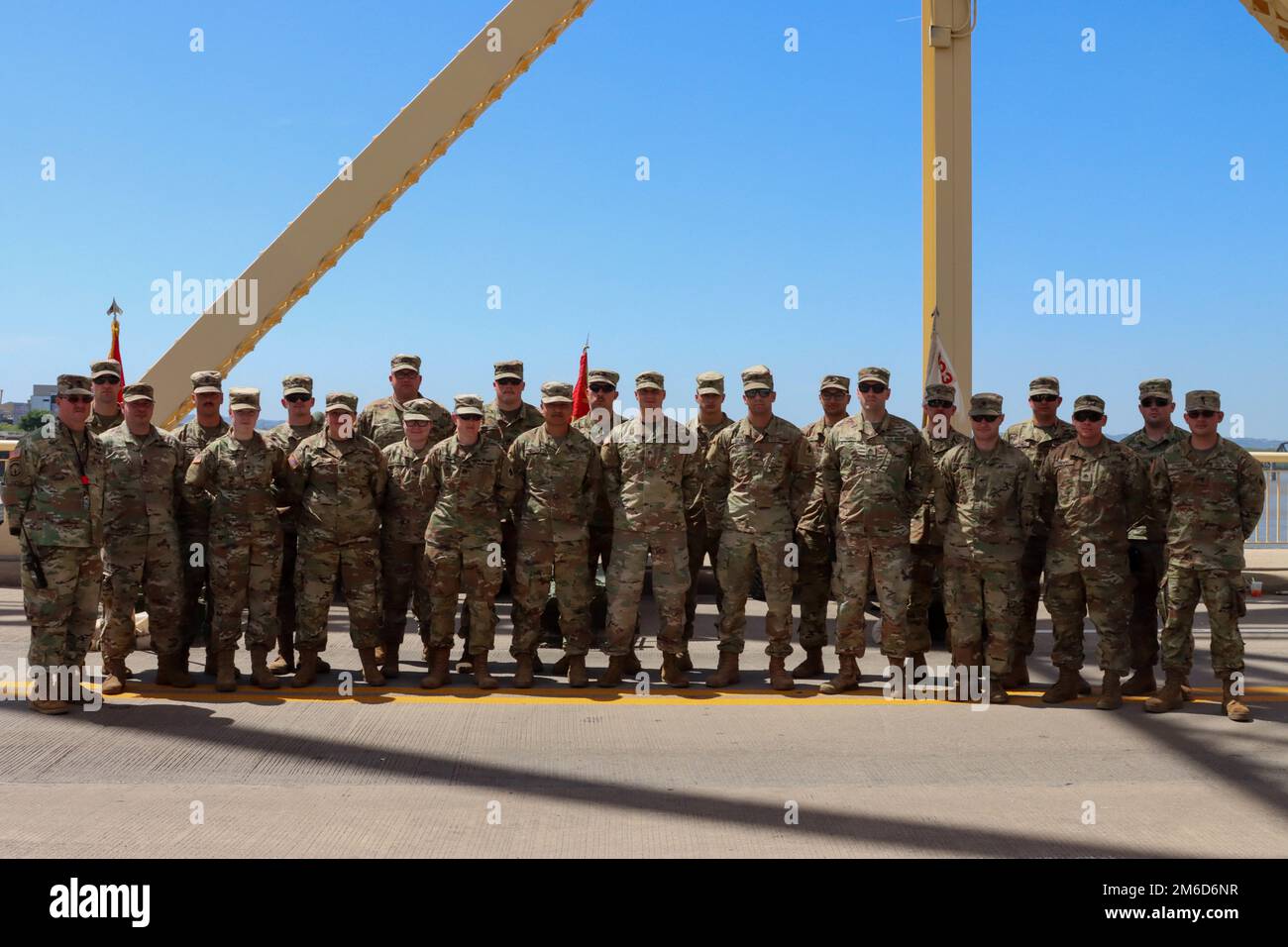 Soldiers from the 2/138th Field Artillery Bn. pose for a photo on the Second Street Bridge on