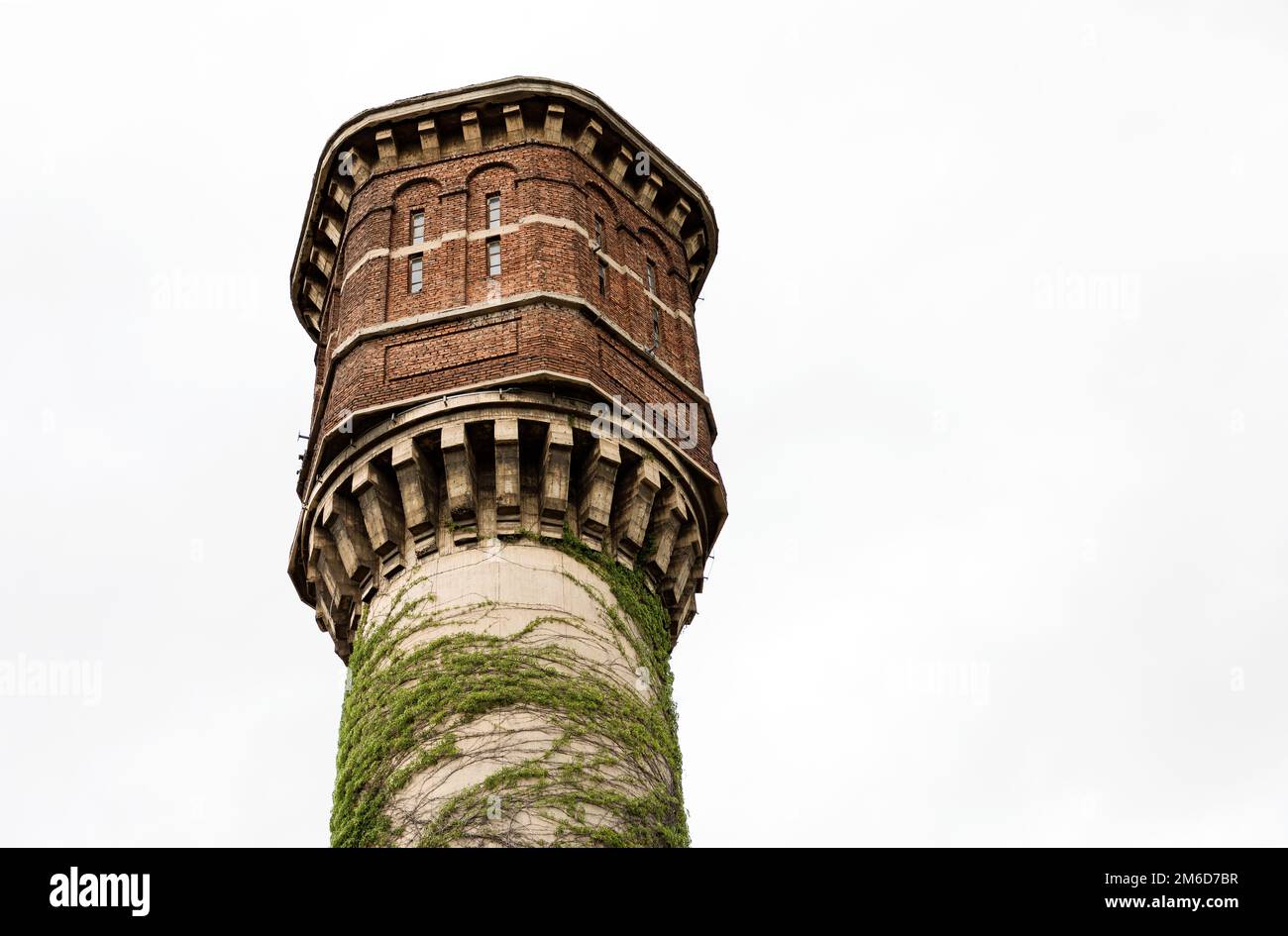 A Close Look At An Old Abandoned Brick And Concrete Water Tower a-close-look-at-an-old-abandoned-brick-and-concrete-water-tower