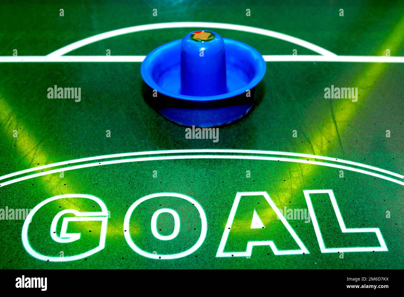 Bright and brilliant air hockey table with instruments for playing