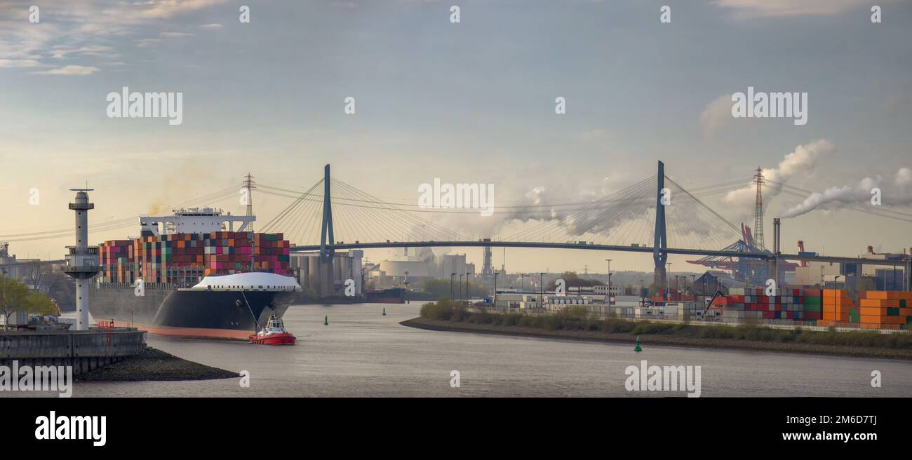 Panorama of a container ship in the morning in the port of Hamburg ...