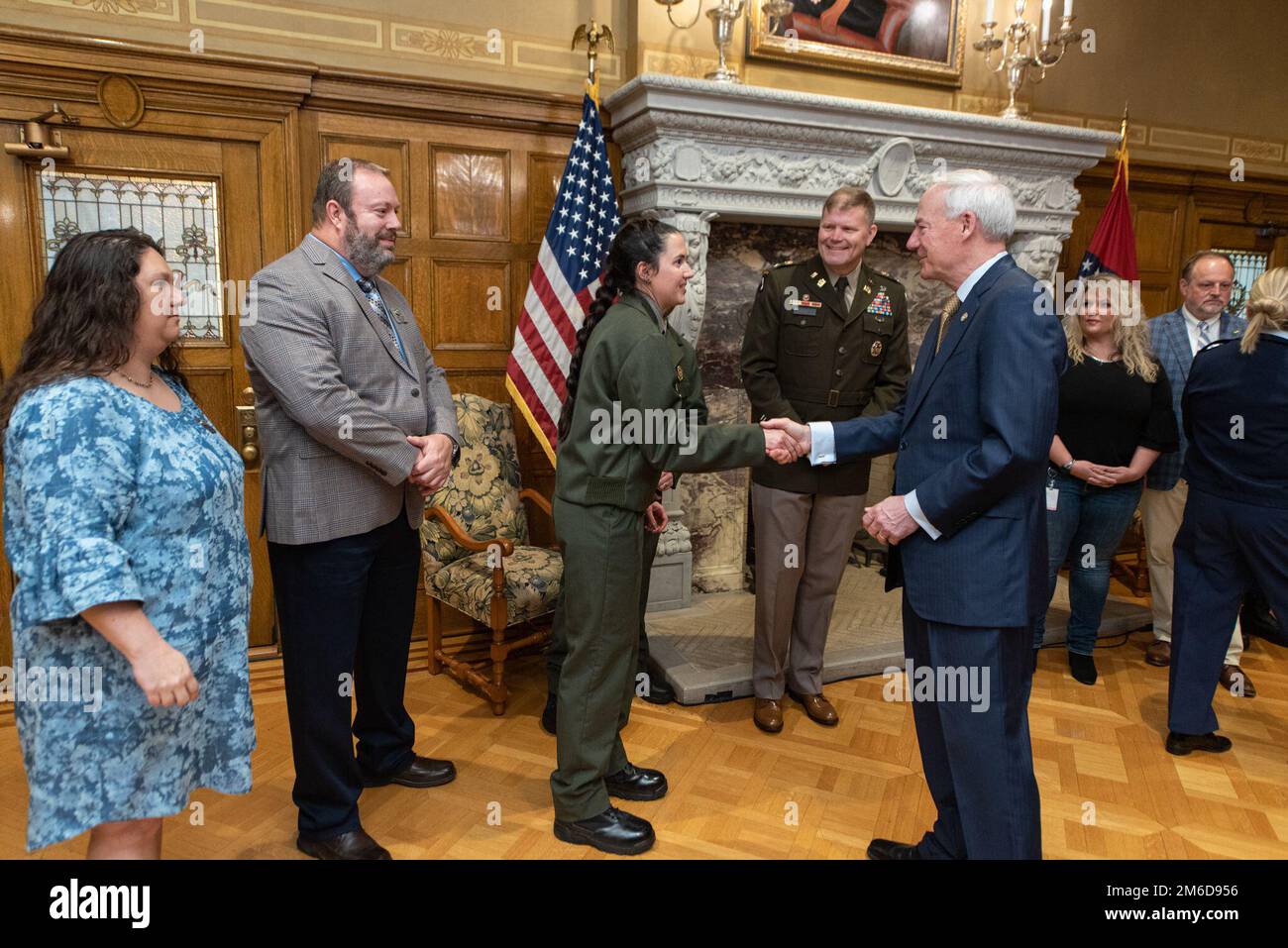 Little Rock District Ranger Mary Simmons, meets Arkansas Governor, Asa Hutchinson for the first time at a Safe Boating Week Proclamation ceremony. Stock Photo