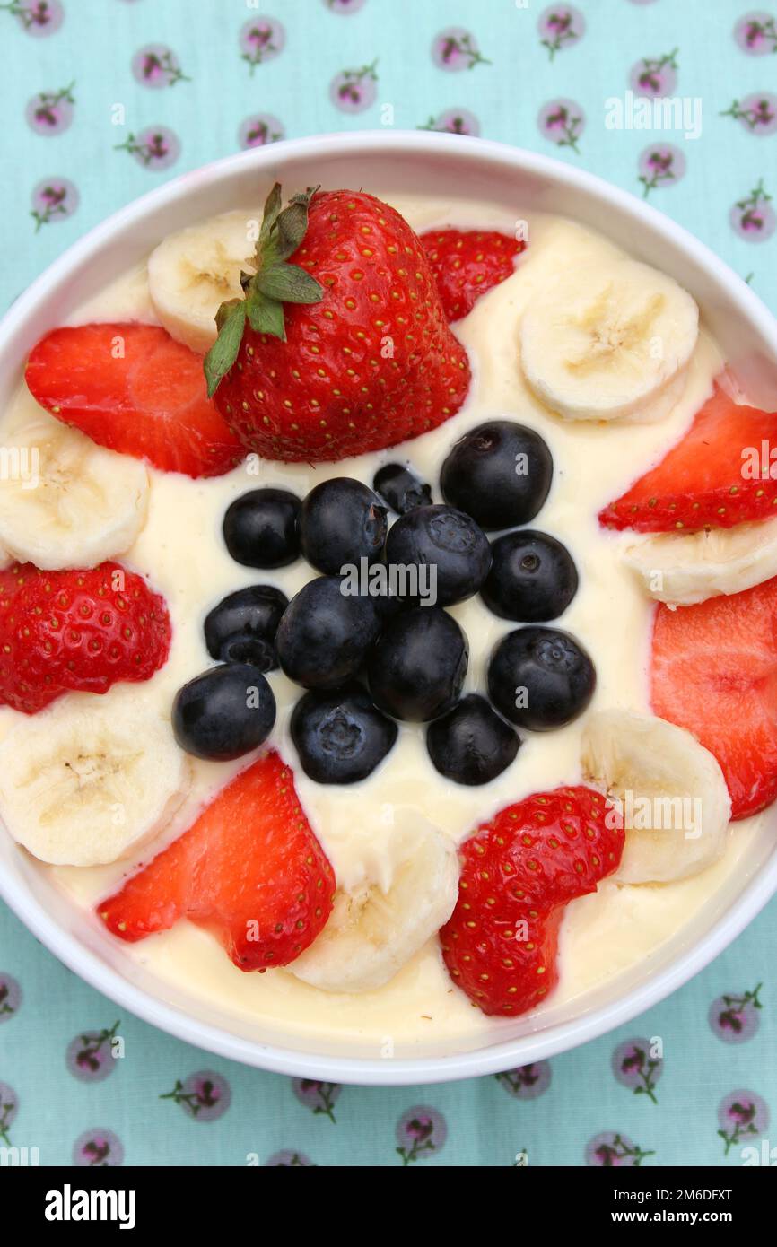 Curd, Strawberries, Blueberries, Bananas Stock Photo