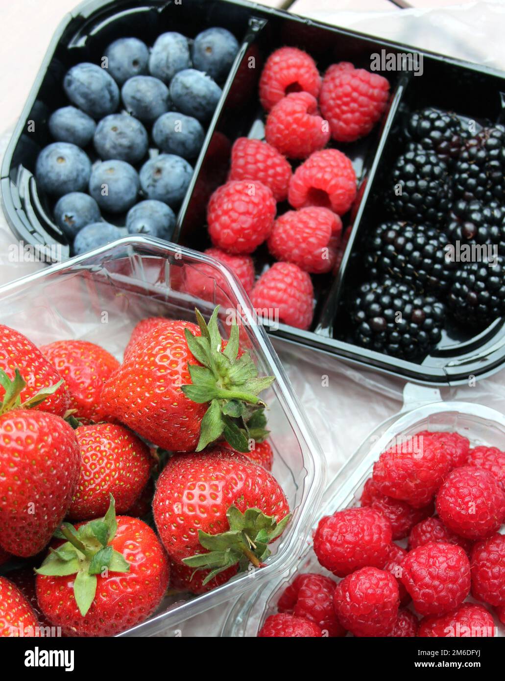 Fresh Fruits in plastic packages Stock Photo