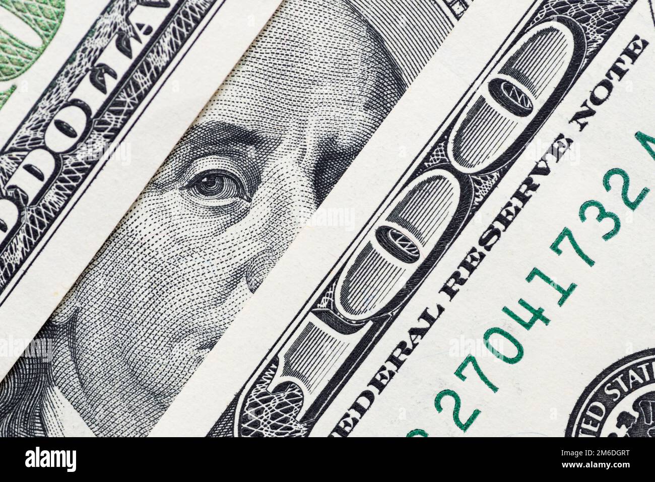 Benjamin Franklin's eyes from a hundred-dollar bill. 100 dollar bill Stock Photo