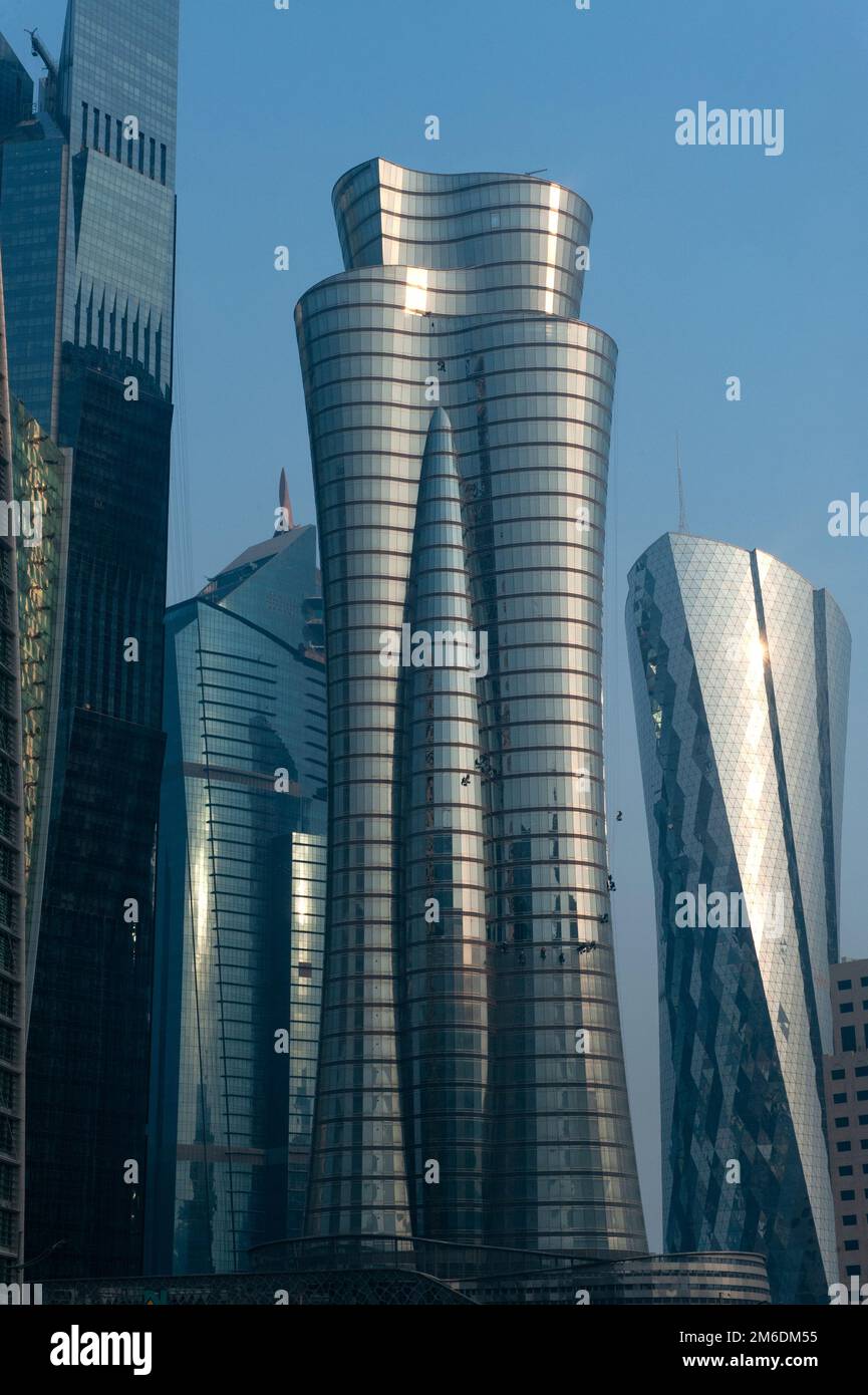 Modern glass fronted skyscrapers and office towers line the Doha skyline, Qatar Stock Photo