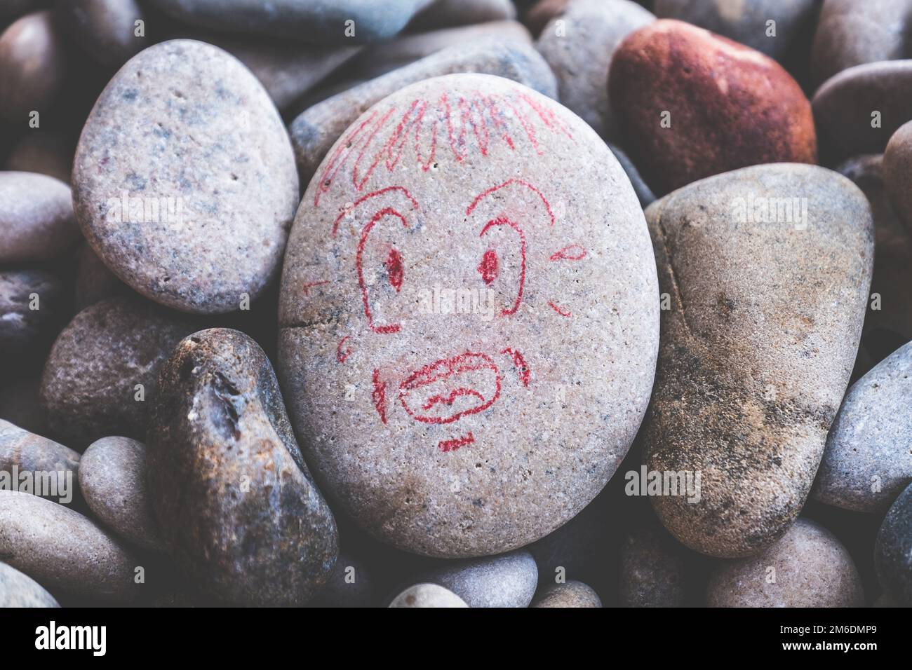 Victim of distress attack panic crisis face in trouble ache and despair expression stone draw Stock Photo