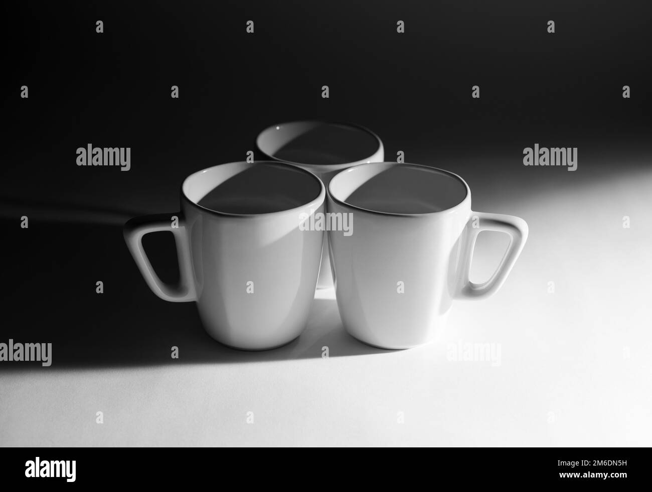 Three empty cups Stock Photo Alamy