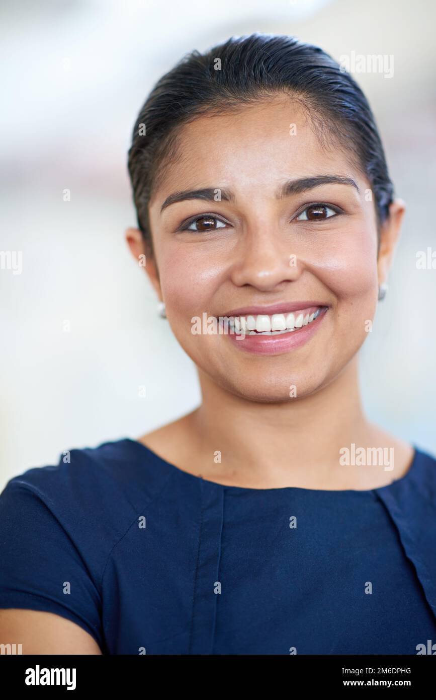 Success makes me smile. Closeup portrait of an attractive young businesswoman in her office. Stock Photo