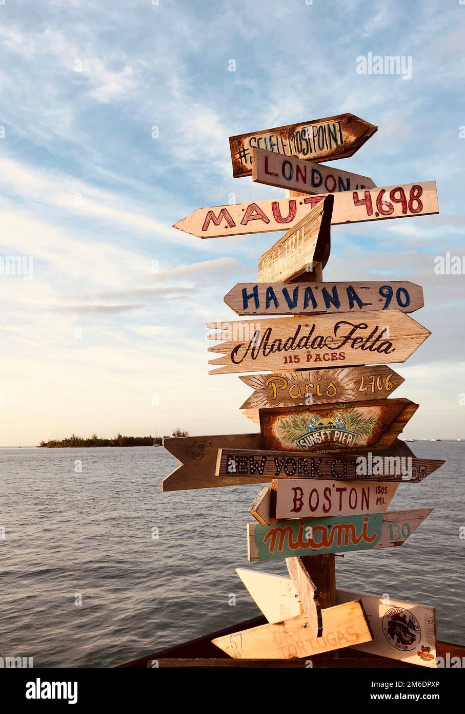 Distance signs to other famous places at Mallory Square on Key West ...