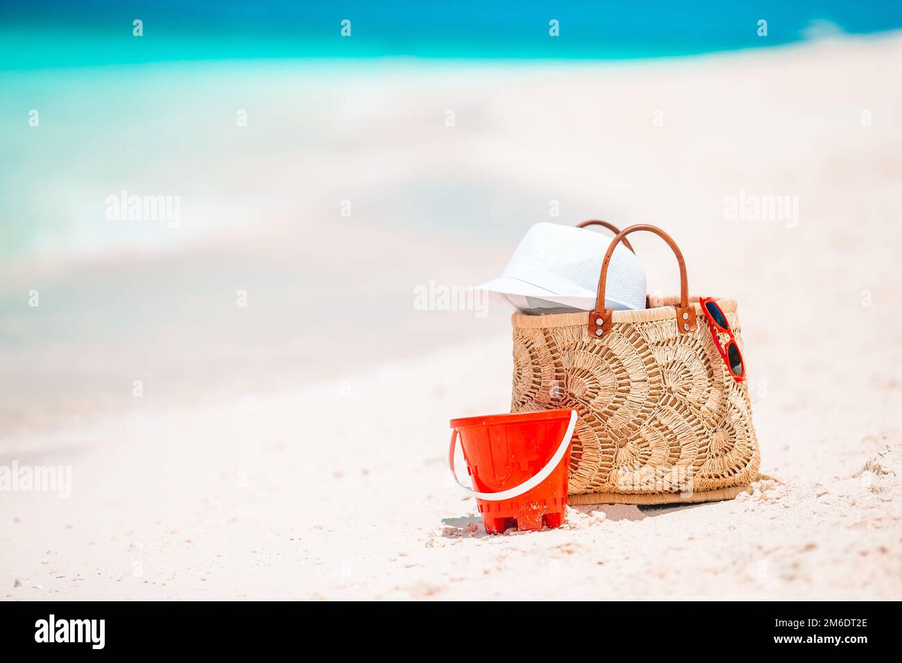 Beach accessories straw bag, hat and unglasses on the beach Stock