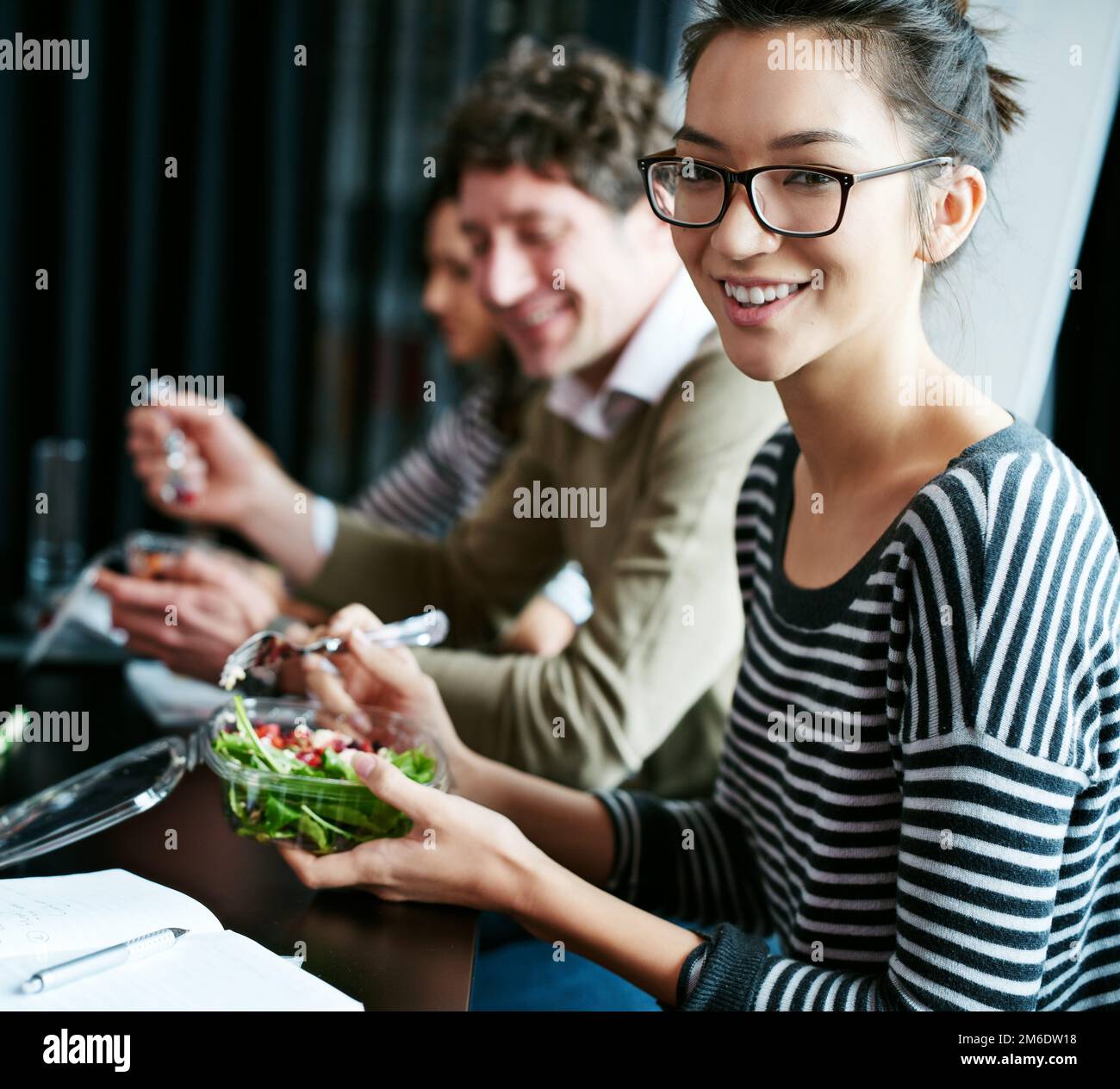 Eating healthy in the workplace. Portrait of a young office worker