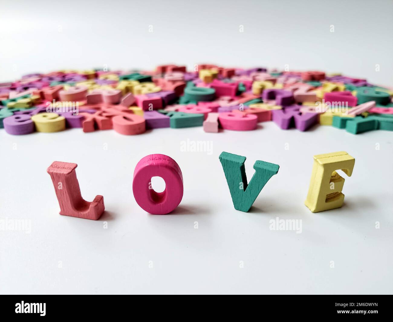 Children's colored letters placed on a white background Stock Photo - Alamy
