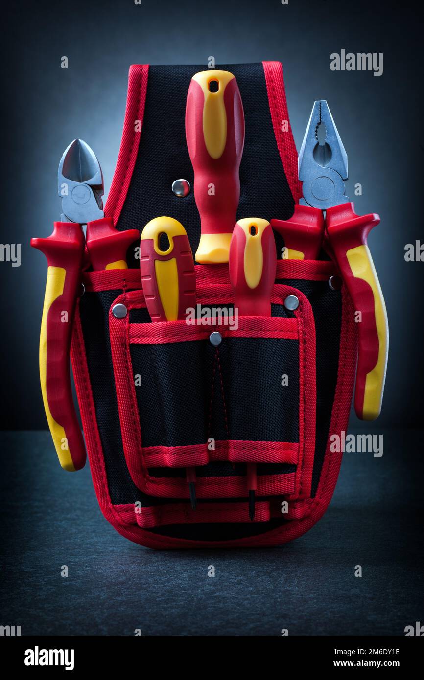 red construction tools on black background Stock Photo - Alamy