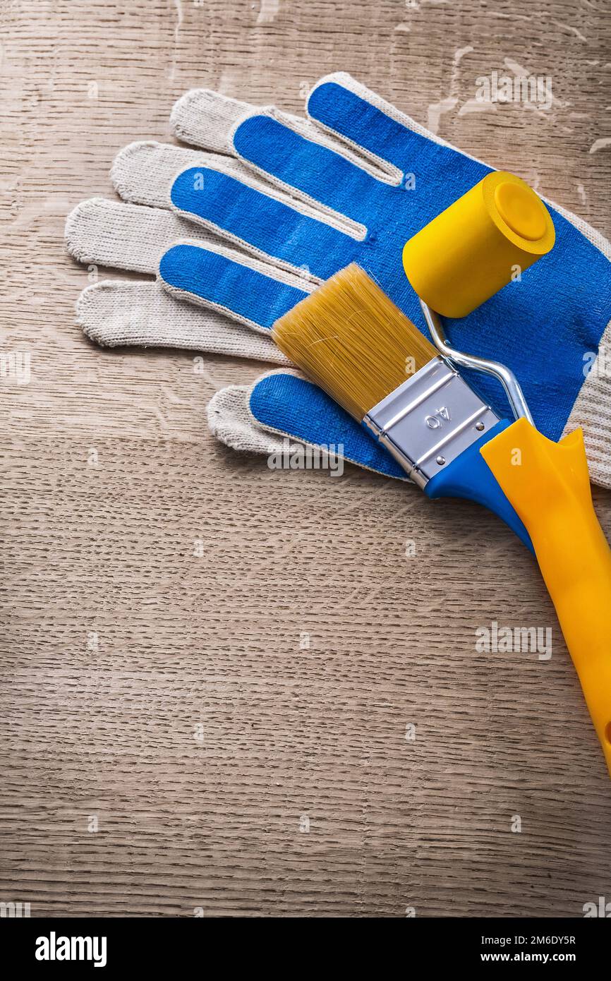 Safety gloves paint brush roller construction concept Stock Photo Alamy