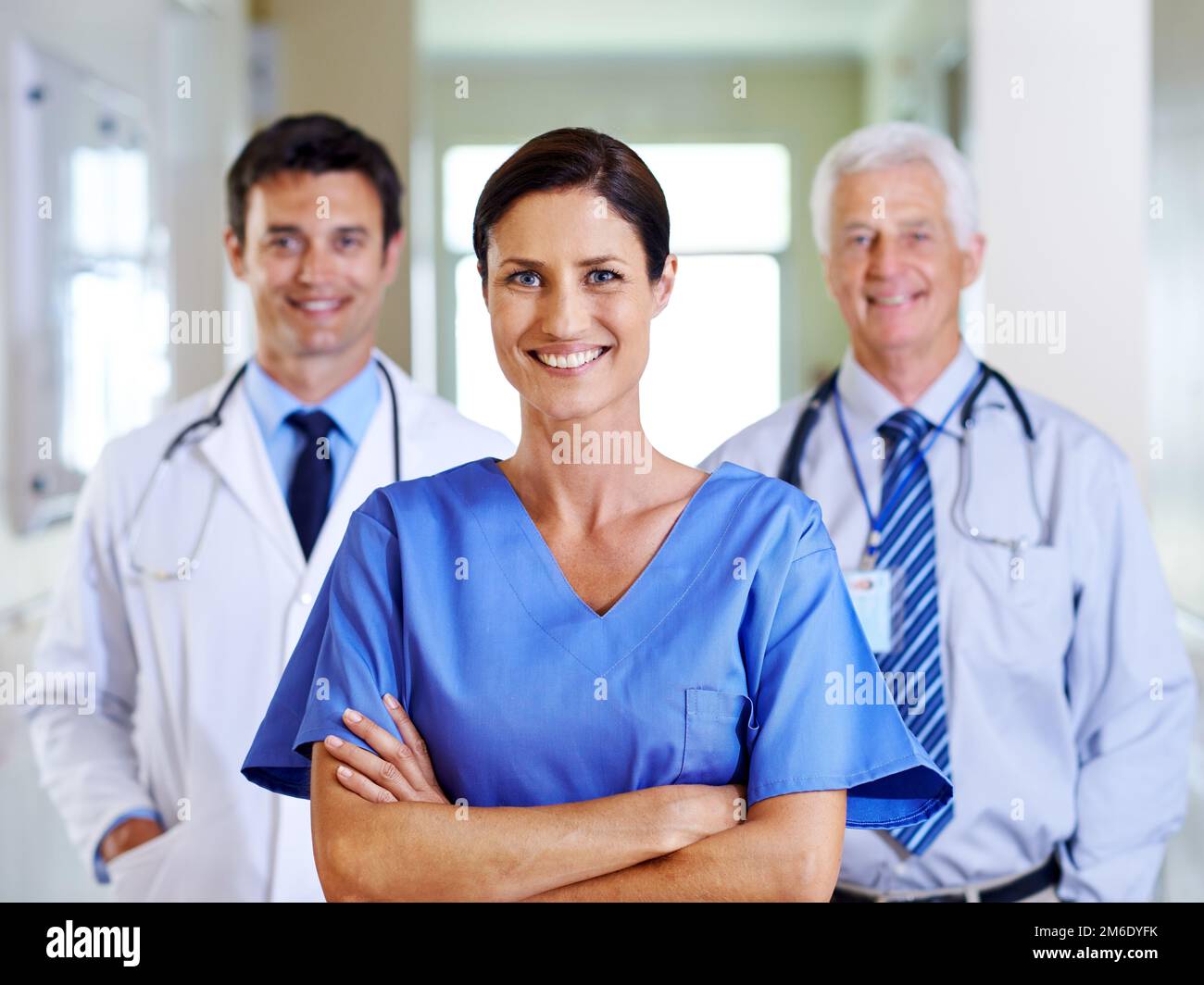 Your friendly medical team. Portrait of three smiling doctors standing