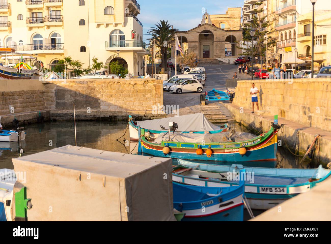 The panorama of harbour on St Paul's Bay with fishing boats and tourist ships, Bugibba, Malta Stock Photo