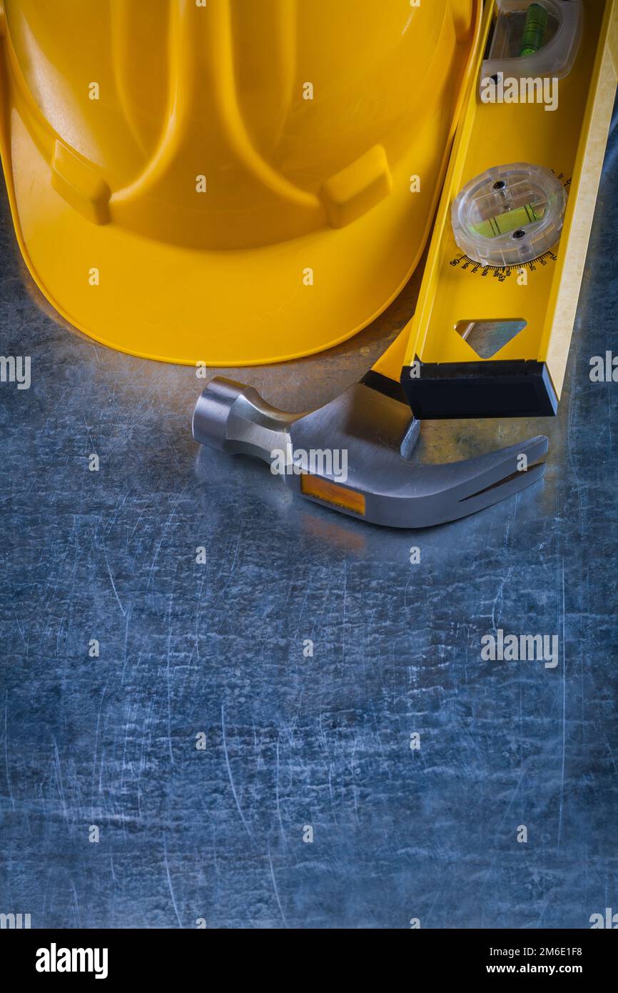Copy space image of claw hammer construction level and building helmet ...