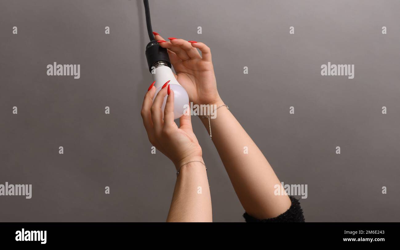 installation of a new energy efficient LED lamp Stock Photo - Alamy