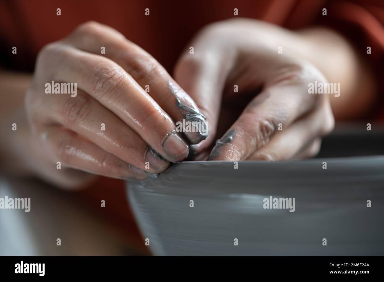 Stressrelieving hobbies, female hands molding wet clay on wheel Stock Photo Alamy