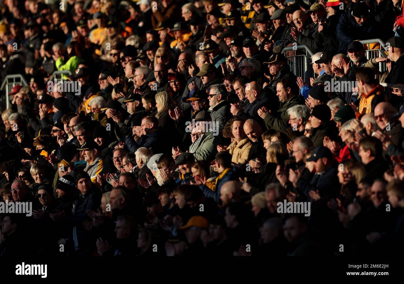 Newport County supporters in the sunshine at Rodney Parade during the EFL League Two match between Newport County and Crawley Town at Rodney Parade. 2nd January 2023 Stock Photo