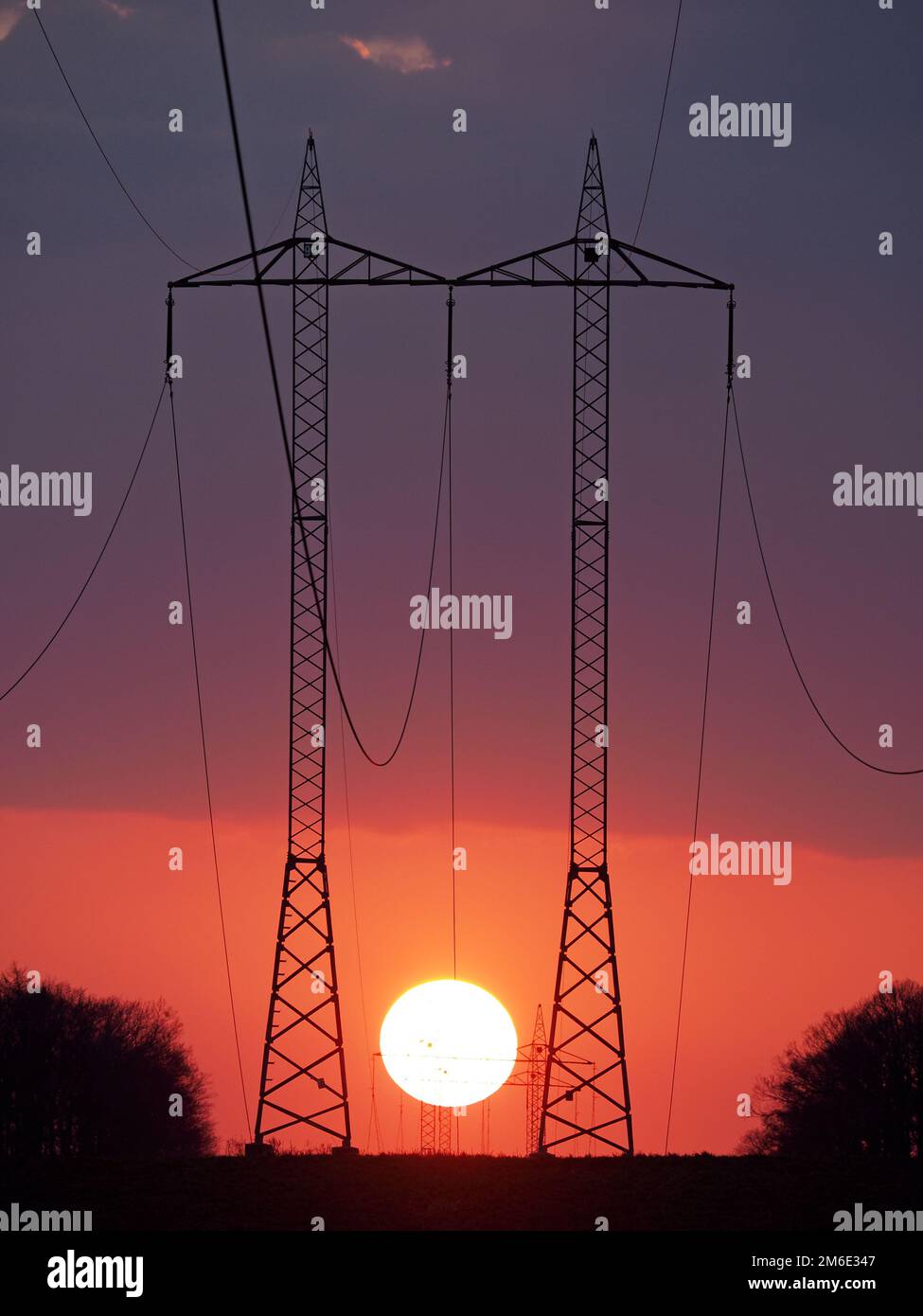 High voltage wires during sunset Stock Photo Alamy