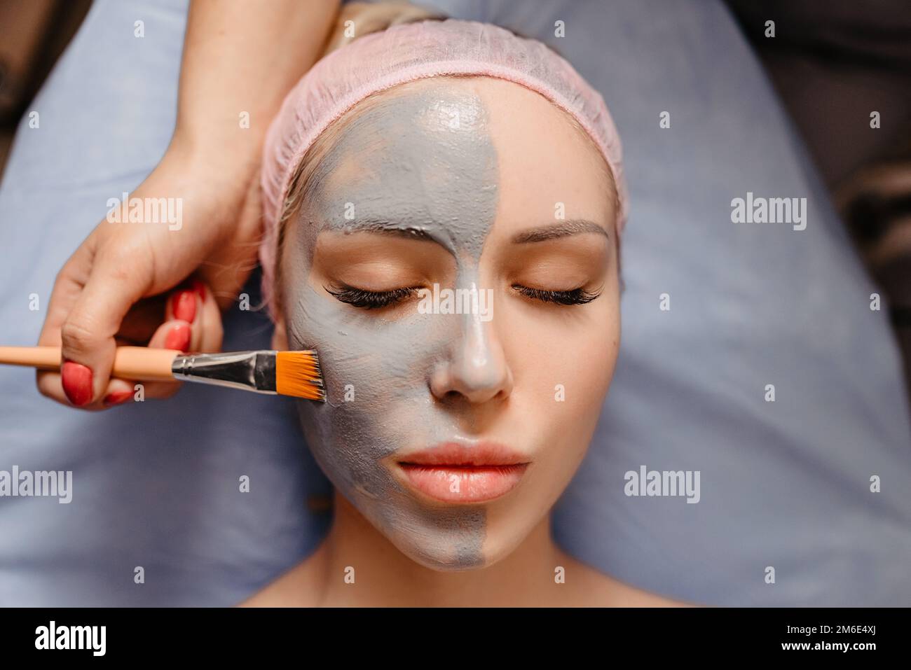 Spa Mud Mask. Woman in Spa Salon. Face Mask. Facial Clay Mask