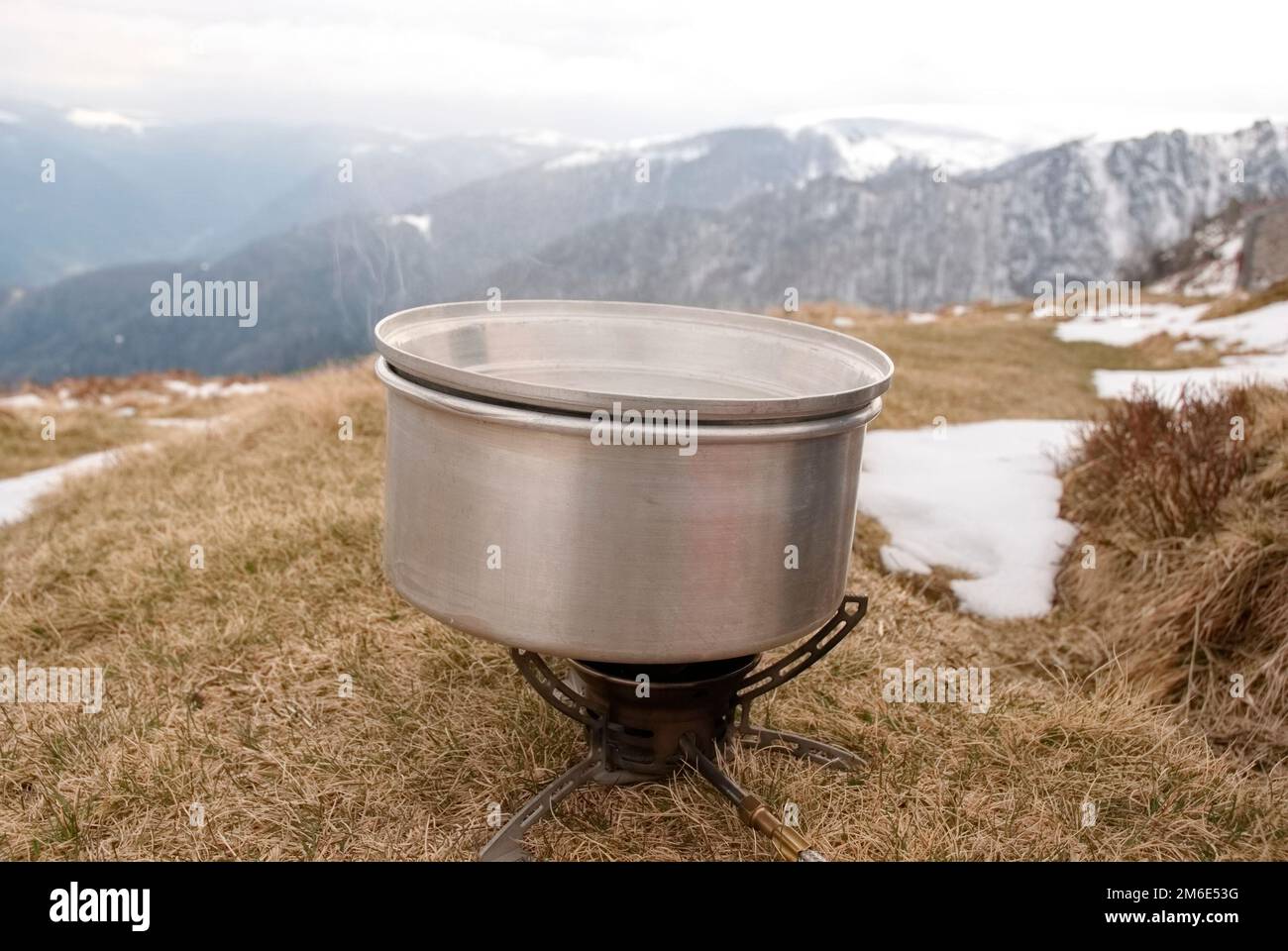 cooking in the mountains after a long hike Stock Photo Alamy