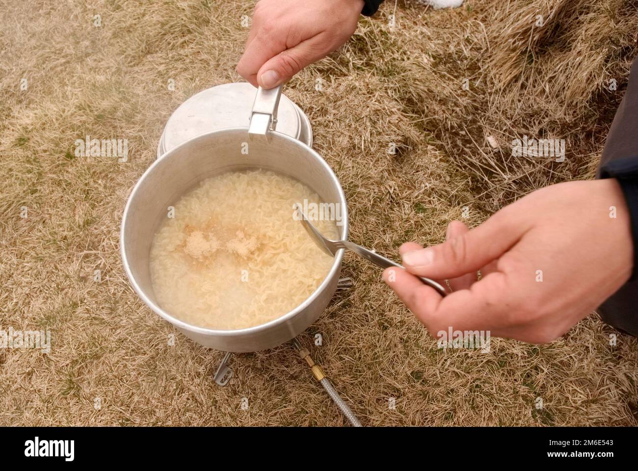 cooking in the mountains after a long hike Stock Photo Alamy