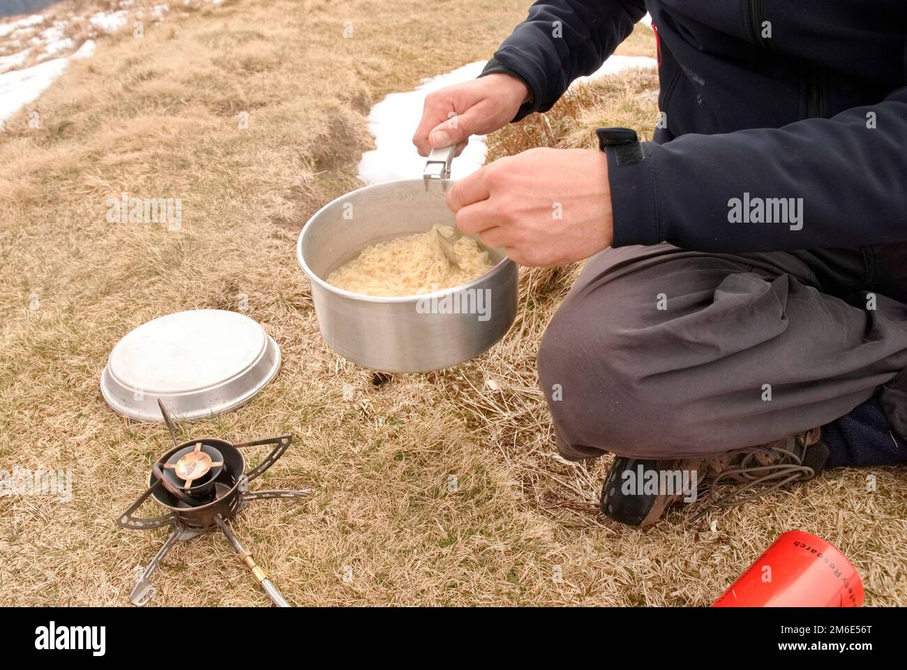 cooking in the mountains after a long hike Stock Photo Alamy