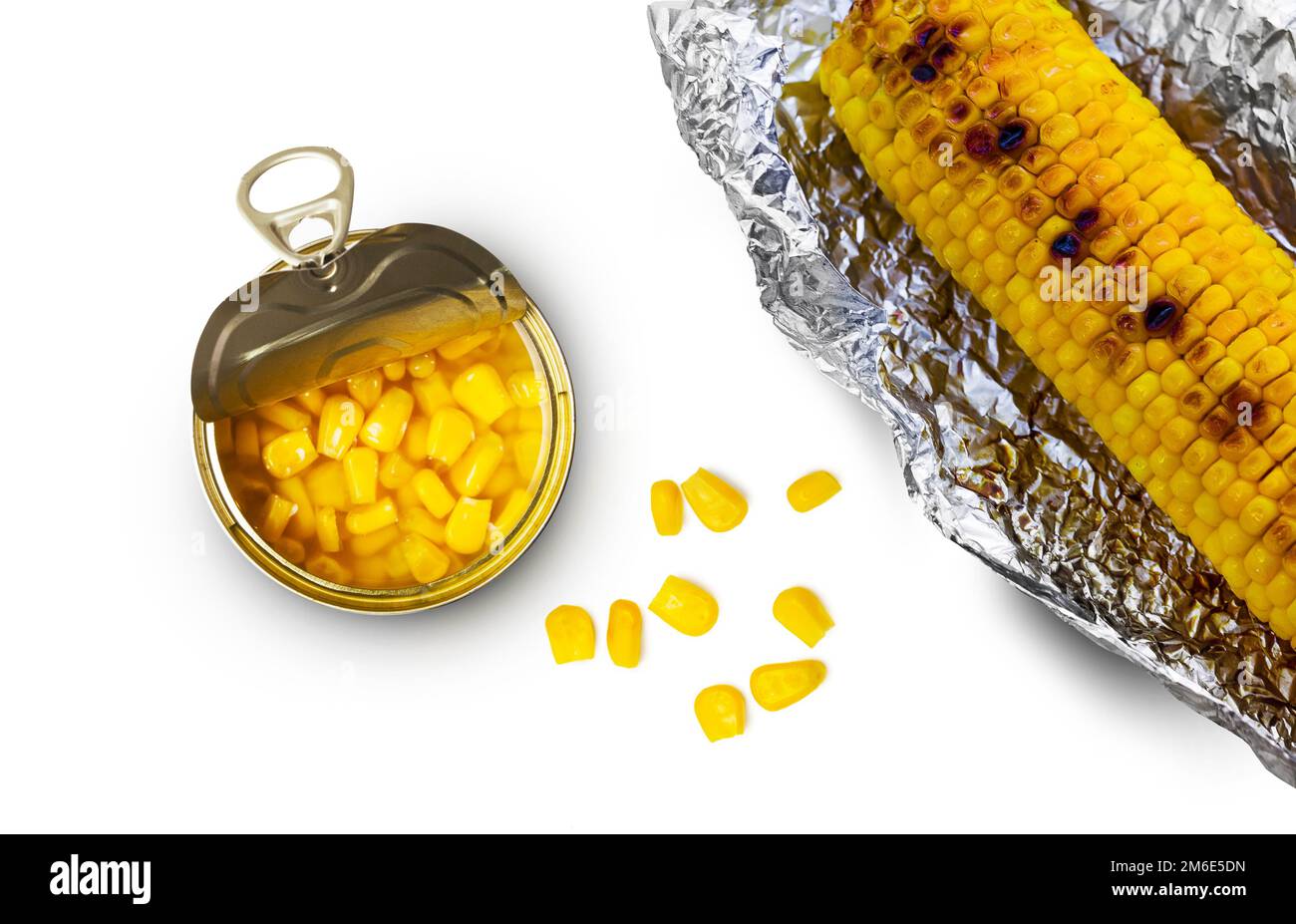 Sweet corn in a tin can and grilled corn in aluminum foil on a white background Stock Photo