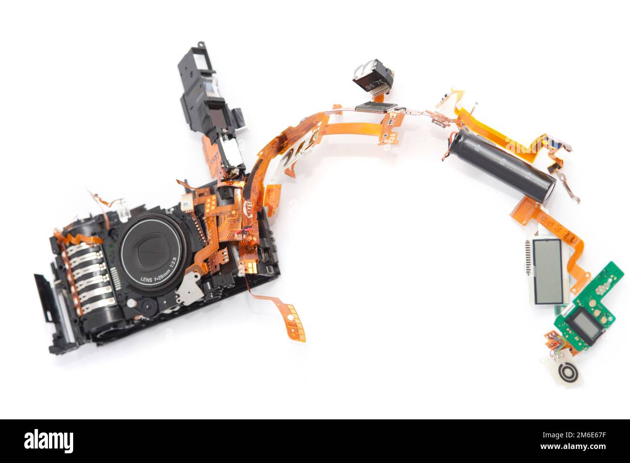 Dismantled camera lying in parts on white Stock Photo
