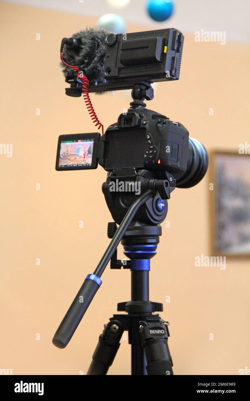 Camera mounted on the tripod ready for shooting. Professional camera