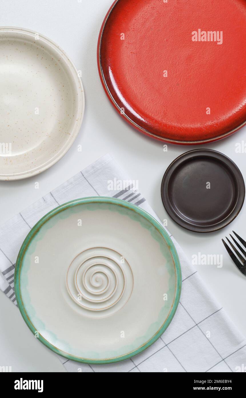 Different empty plates on white table, top view Stock Photo