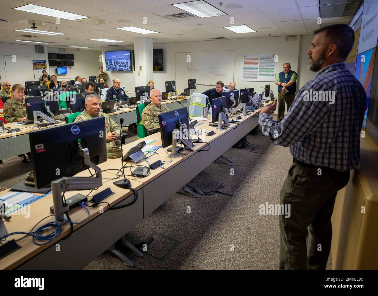 220426-N-PC620-0045  DENVER (April 26, 2022) Zack Lamb, right, the Federal Emergency Management Agency Region 8 response division director, describes the capabilities of the regional response coordination center during a catastrophic incident response to Joint Task Force Civil Support Commanding General, Maj. Gen. Jeff Van, center left, and U.S. Army North Commanding General, Lt. Gen. John Evans, center, during exercise Vibrant Response 22, April 26, 2022.  Joint Task Force Civil Support conducts chemical, biological, radiological and nuclear response and all-hazards defense support to civil a Stock Photo