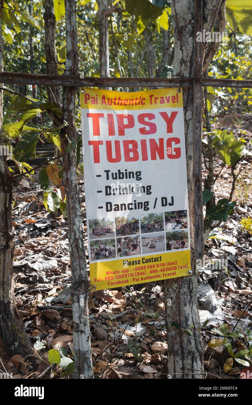 Pai, Thailand. November 20, 2022. Tipsy tubing ad in the forest of Pai, Thailand Stock Photo