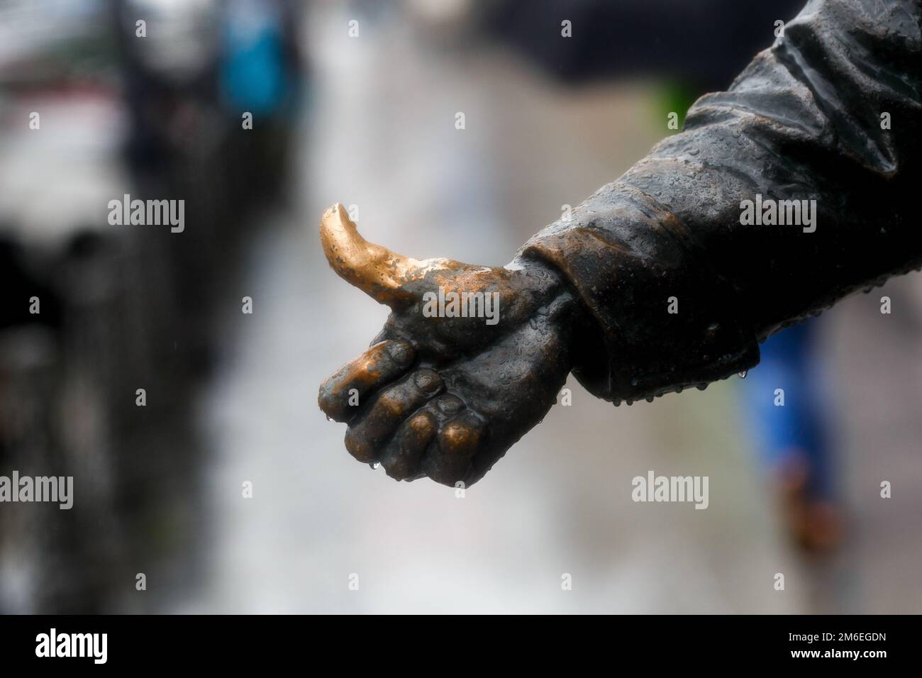 Closeup. Hitchhiker's bronze finger on the monument Stock Photo Alamy