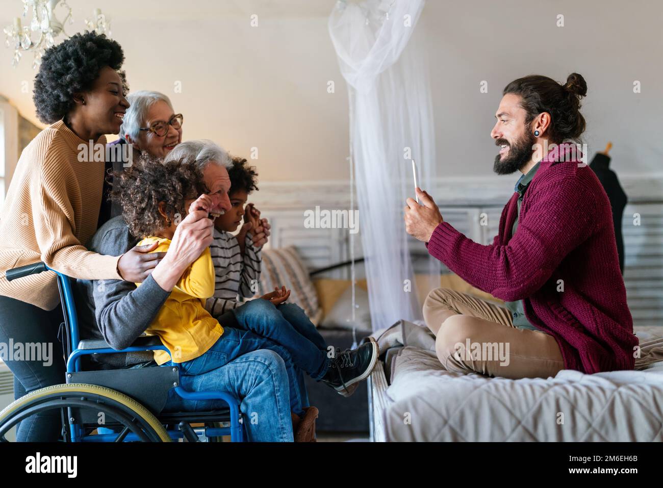Portrait of multiethnic happy multi-generation family spending time together Stock Photo