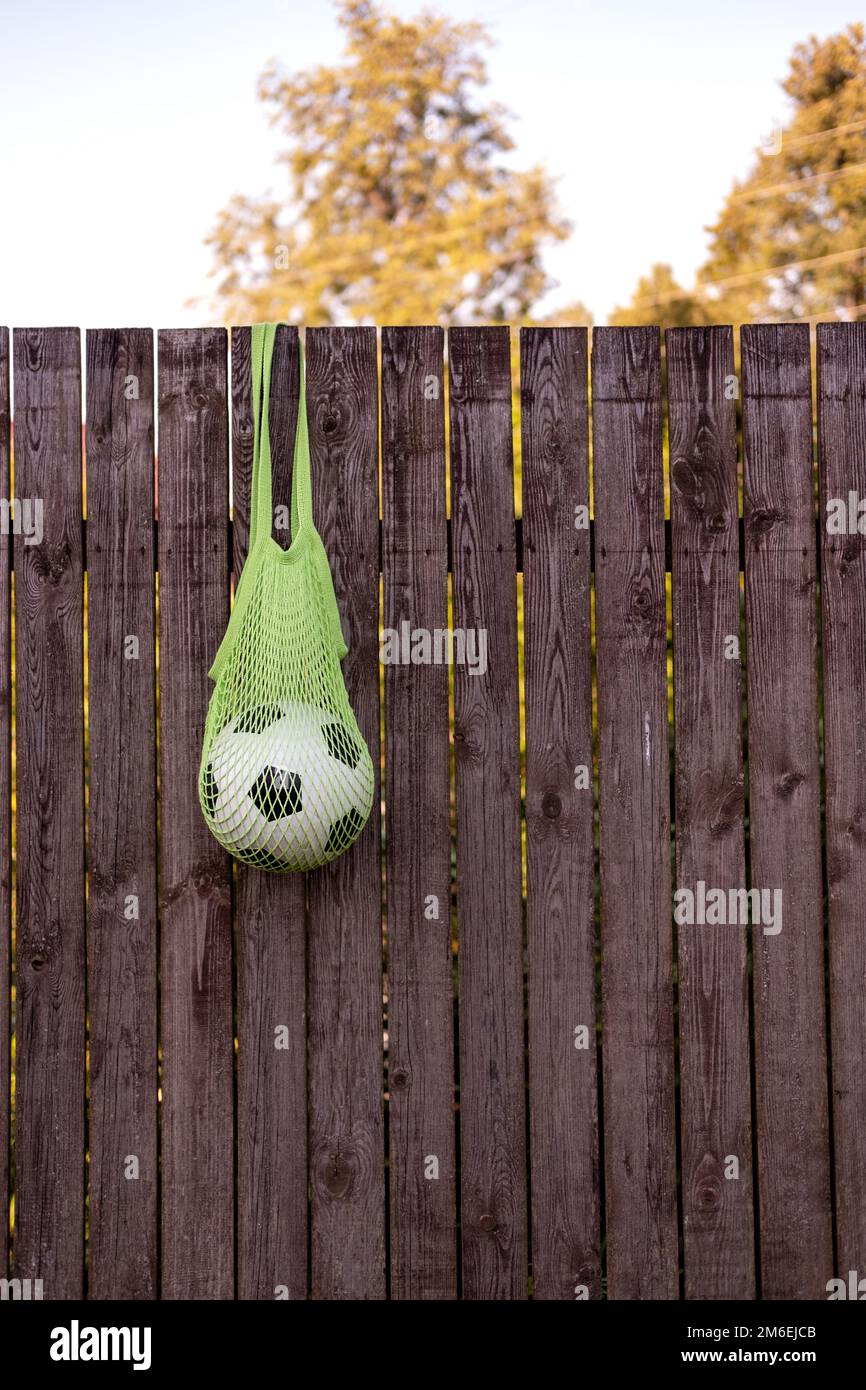 Soccer ball in eco mesh shopping bag Stock Photo Alamy