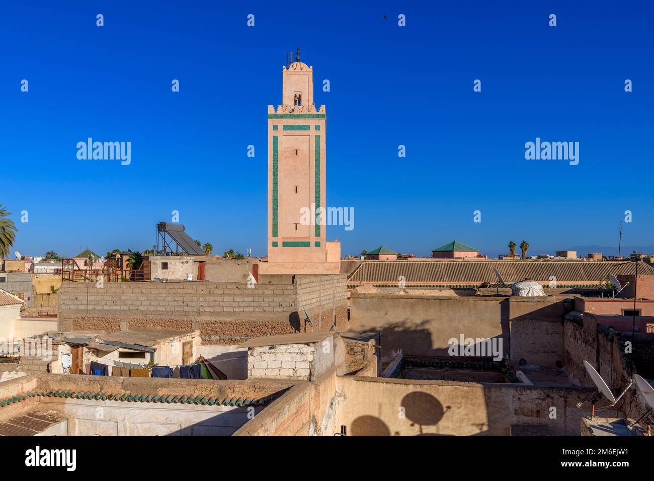 Over the rooftops in Marrakech. Shot from The Tower at The Secret Gardens. Elaborate minarets to modern solar panels; palm trees to satellite dishes. Stock Photo