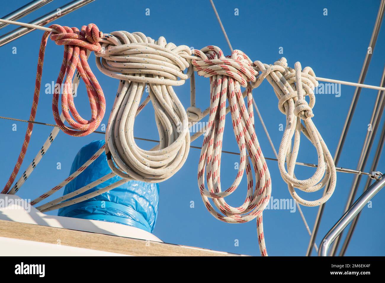 Coiled ship ropes on railing of motorboat closeup Stock Photo - Alamy