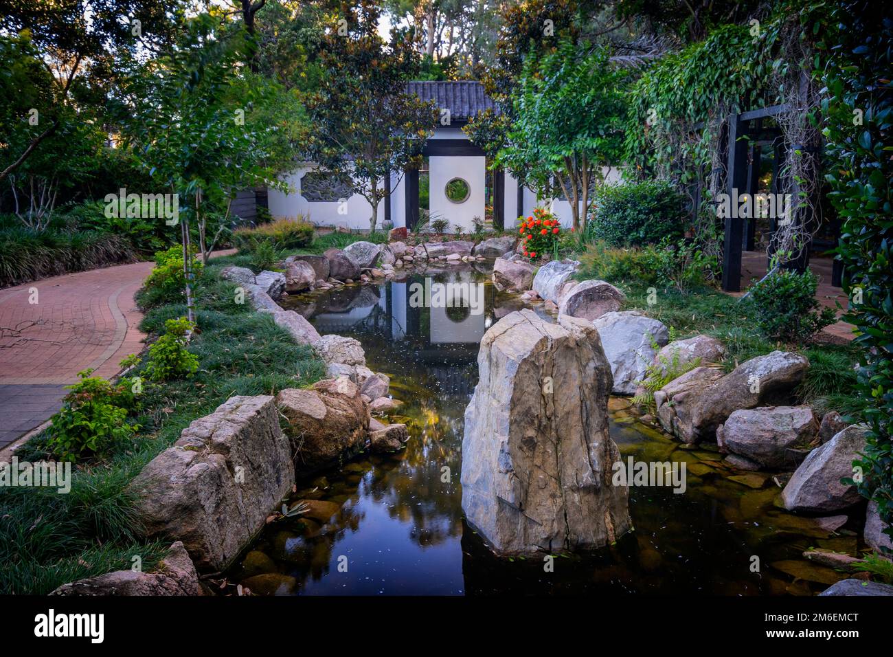 Water feature Chinese inspired formal garden, moon gate and Zen garden. Hervey Bay Botanic Gardens, Urangan Hervey Bay Queensland Australia Stock Photo