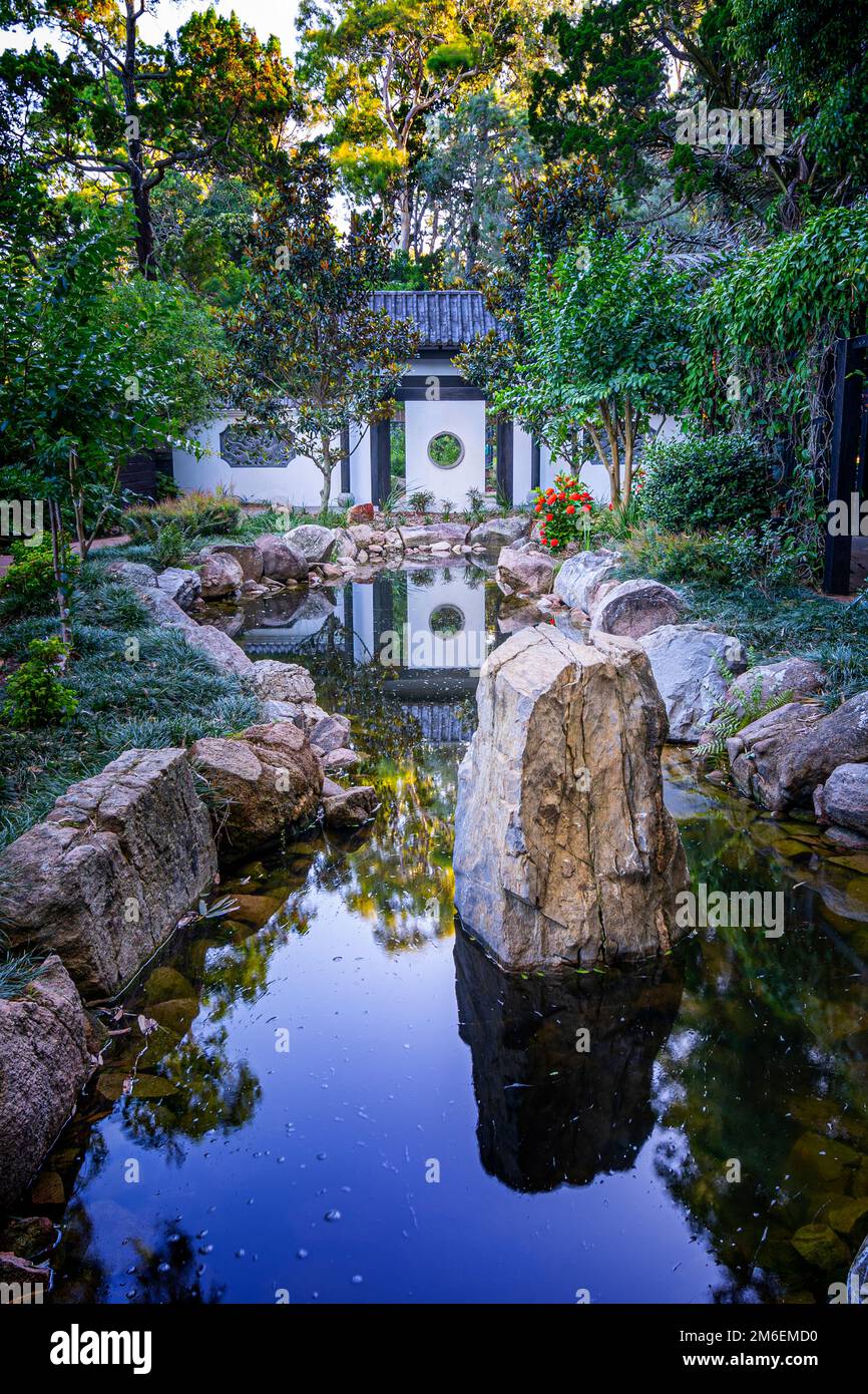 Water feature Chinese inspired formal garden, moon gate and Zen garden. Hervey Bay Botanic Gardens, Urangan Hervey Bay Queensland Australia Stock Photo