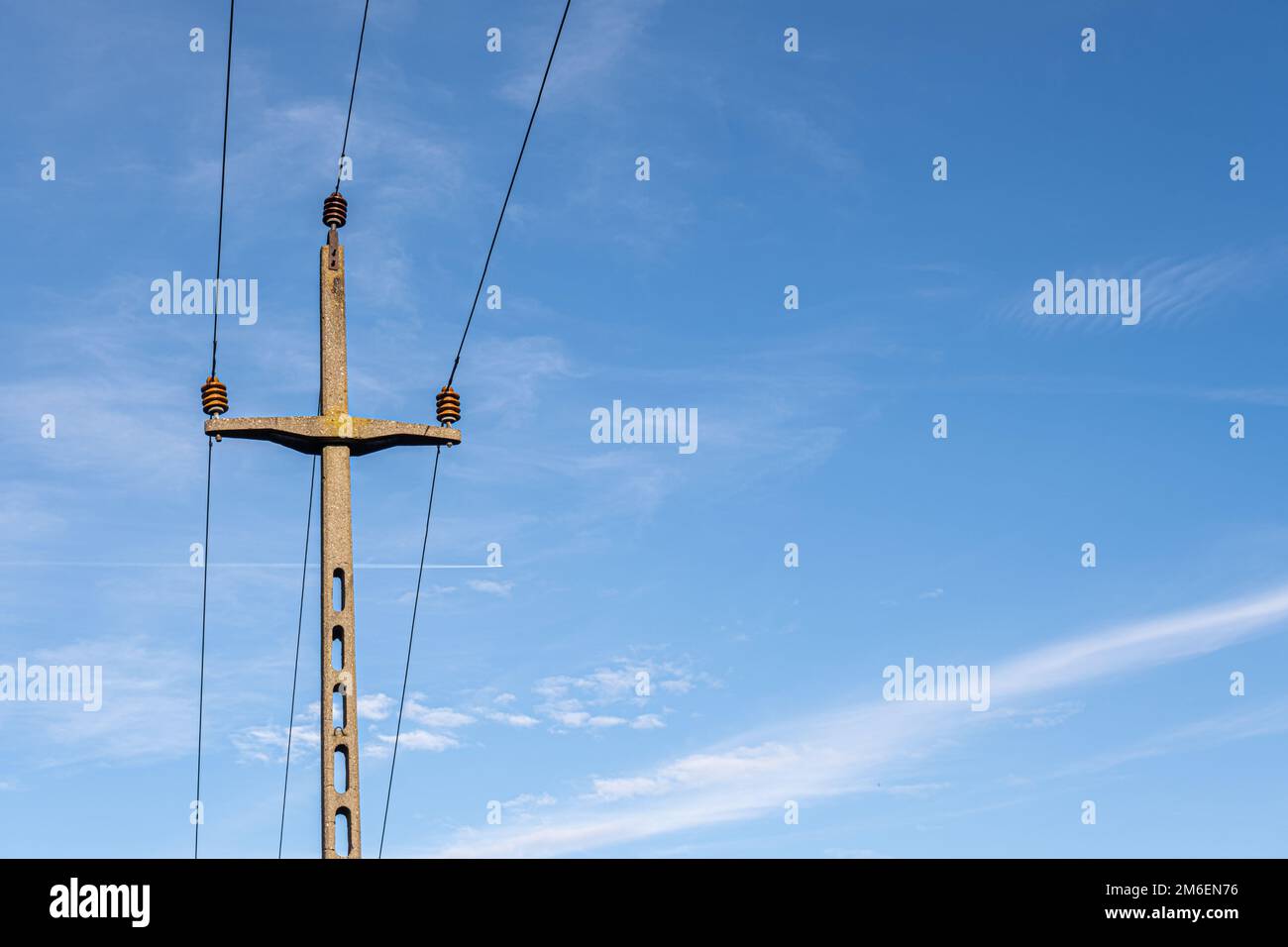 concrete electricity poles with wires against the sky Stock Photo - Alamy