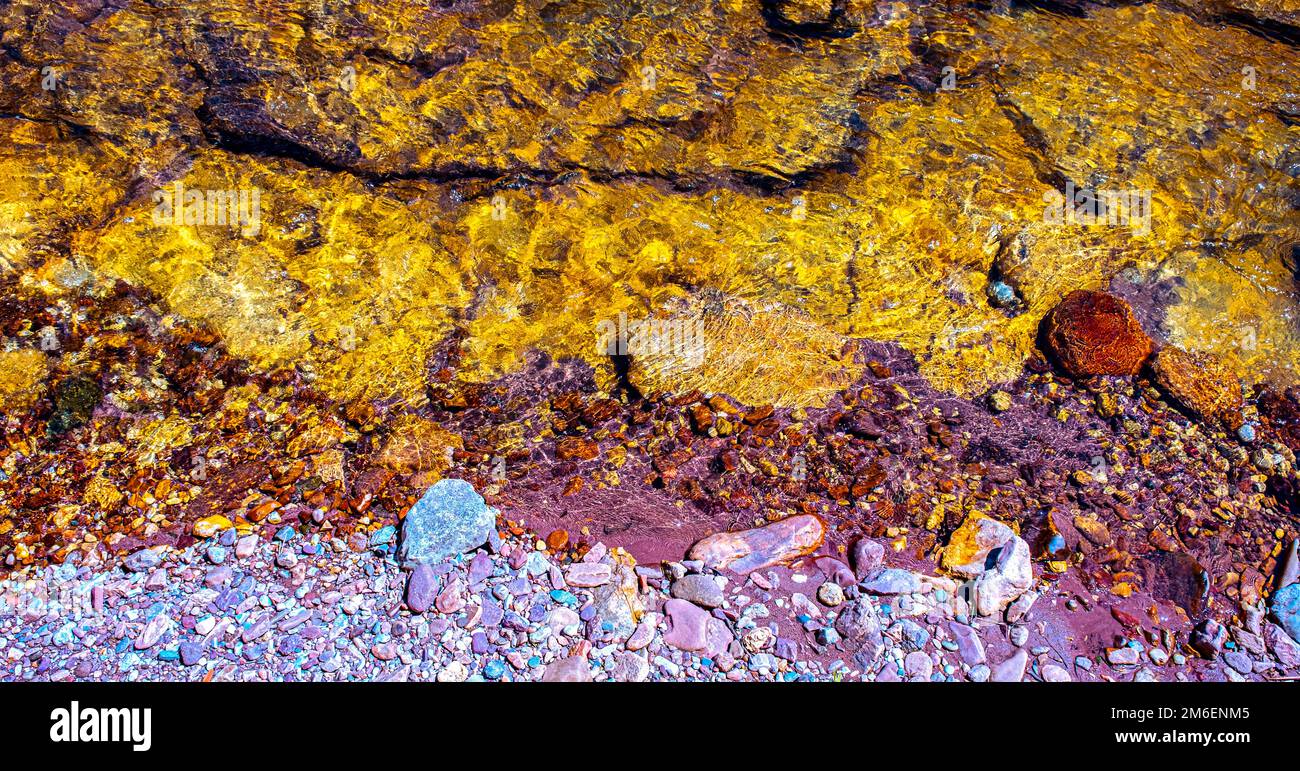 smooth clear water float on colored stone Stock Photo Alamy