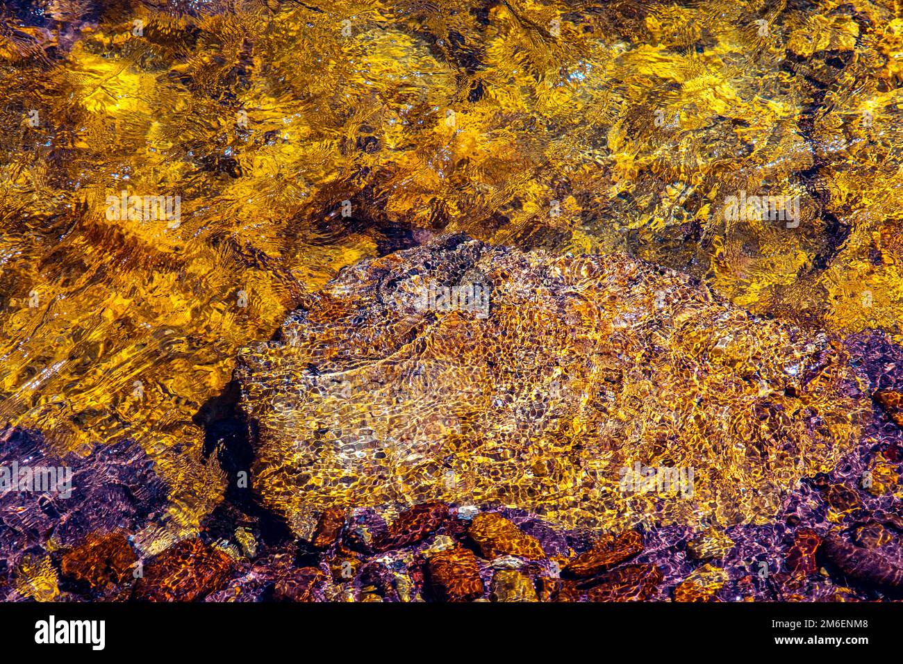 smooth clear water float on colored stone Stock Photo Alamy