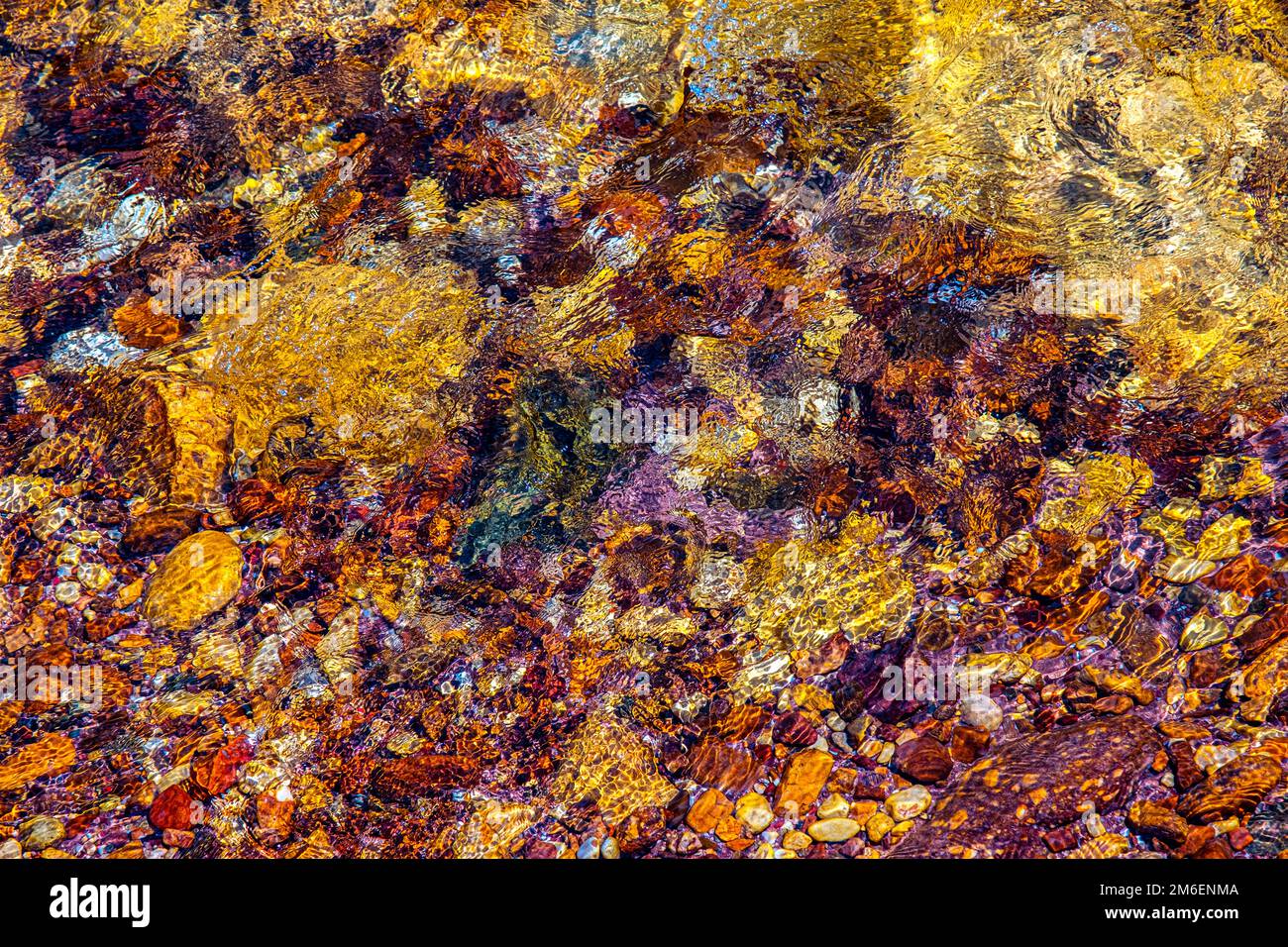 smooth clear water float on colored stone Stock Photo Alamy