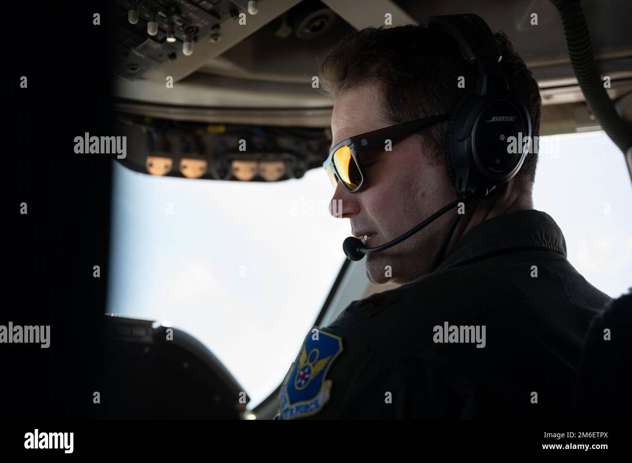 Maj. Garrett Kohl, an E-4B “Nightwatch” pilot and member of the 595th Command and Control Group, performs flying duties during a media day/orientation flight for local, trade and national media at Lincoln Airport, NE on April 26, 2022. E-4Bs are protected against the effects of electromagnetic pulse to secure internal communication systems from any external interference. Stock Photo